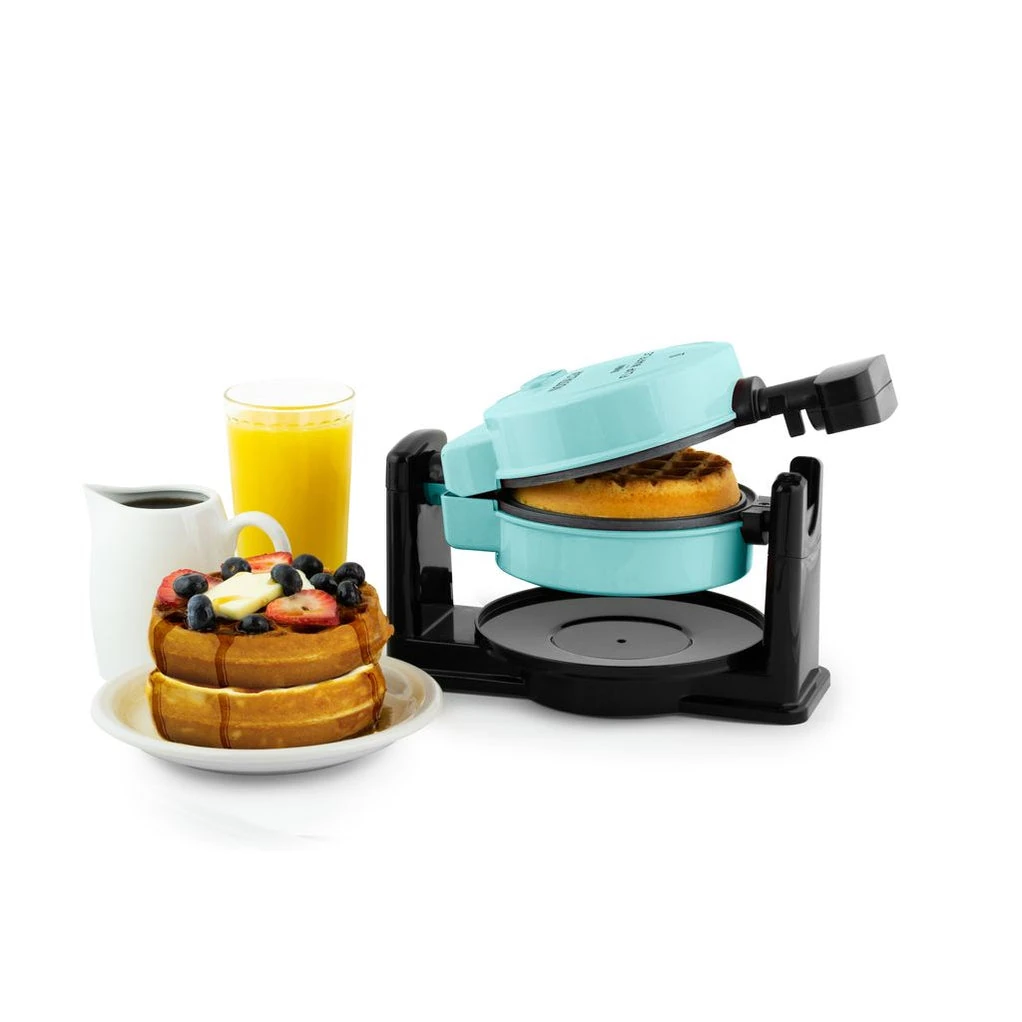 Nostalgia Aqua MyMini Flip waffle maker open above one waffle and catch tray