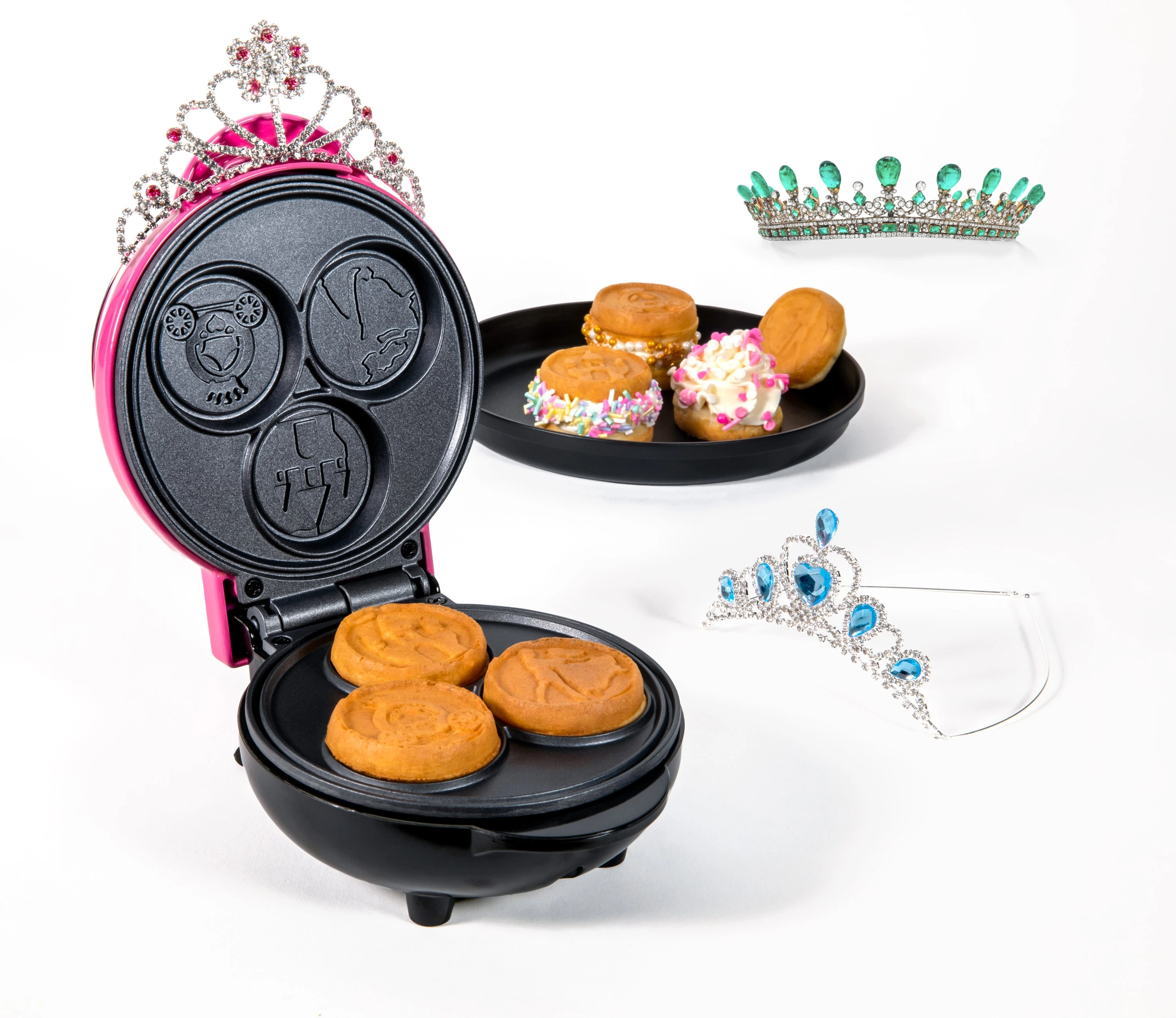 Exact NMWFPRNCS5PK manufacturer product photograph showing its installed three round Princess wells. Food and decorative props illustrate serving; only the appliance is assessed.